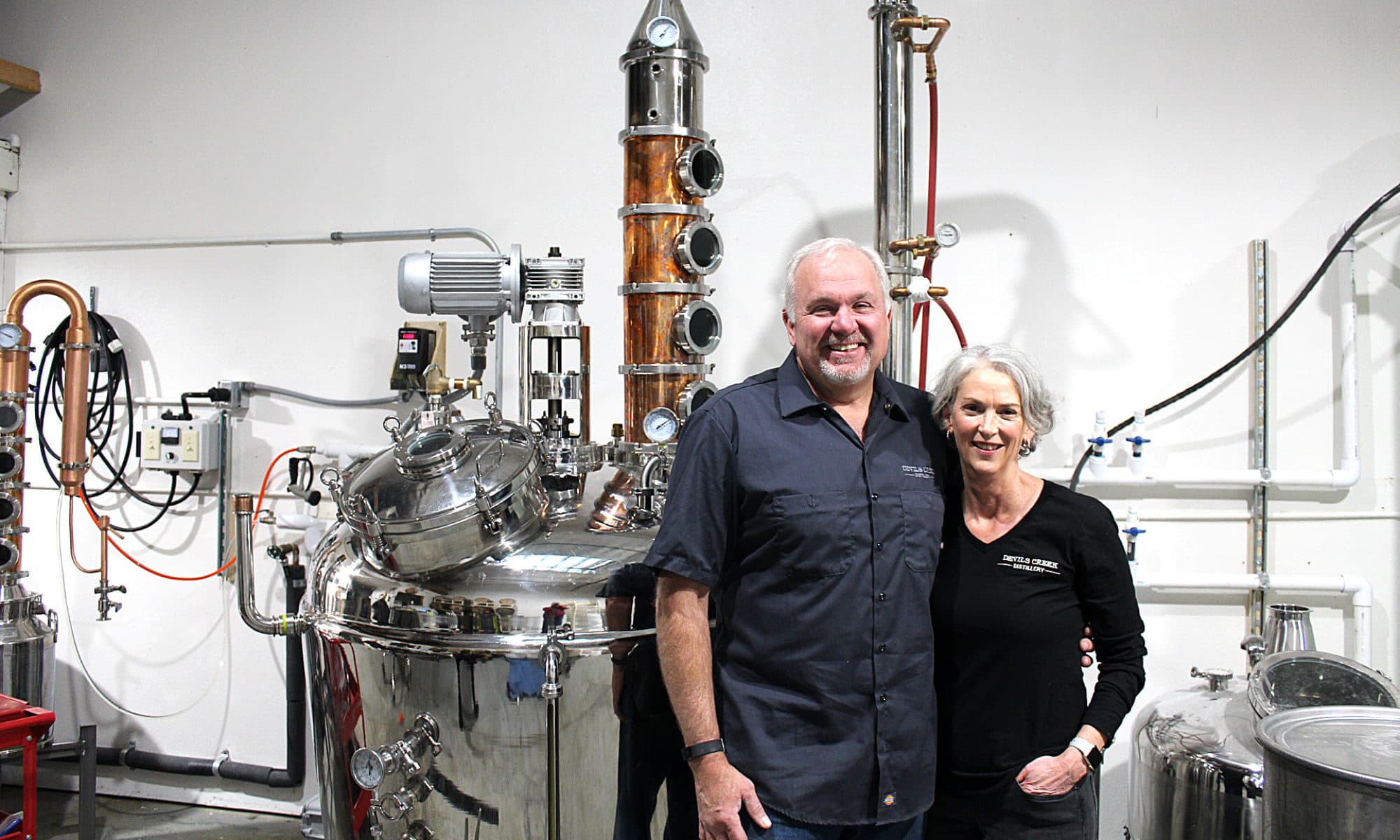 John and Luan Mendel at the still
