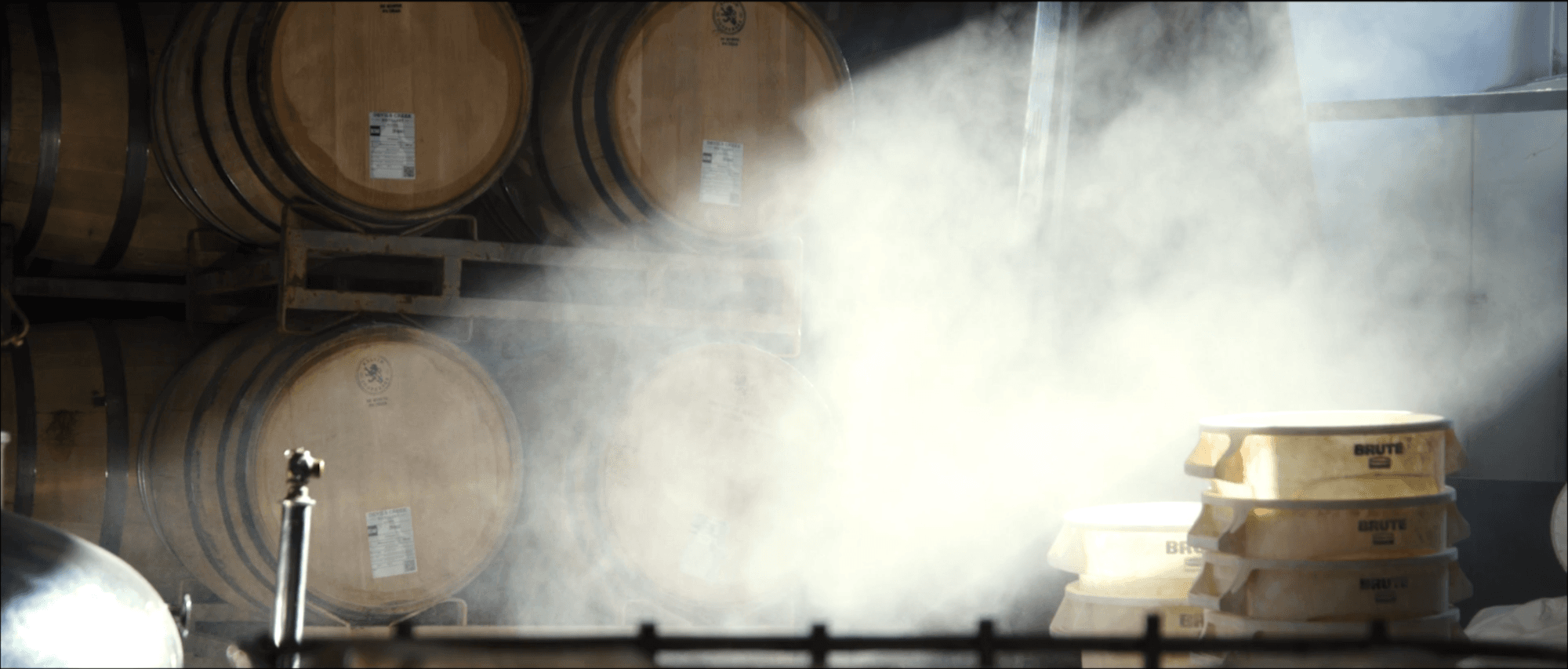 Steam and barrels in the still house